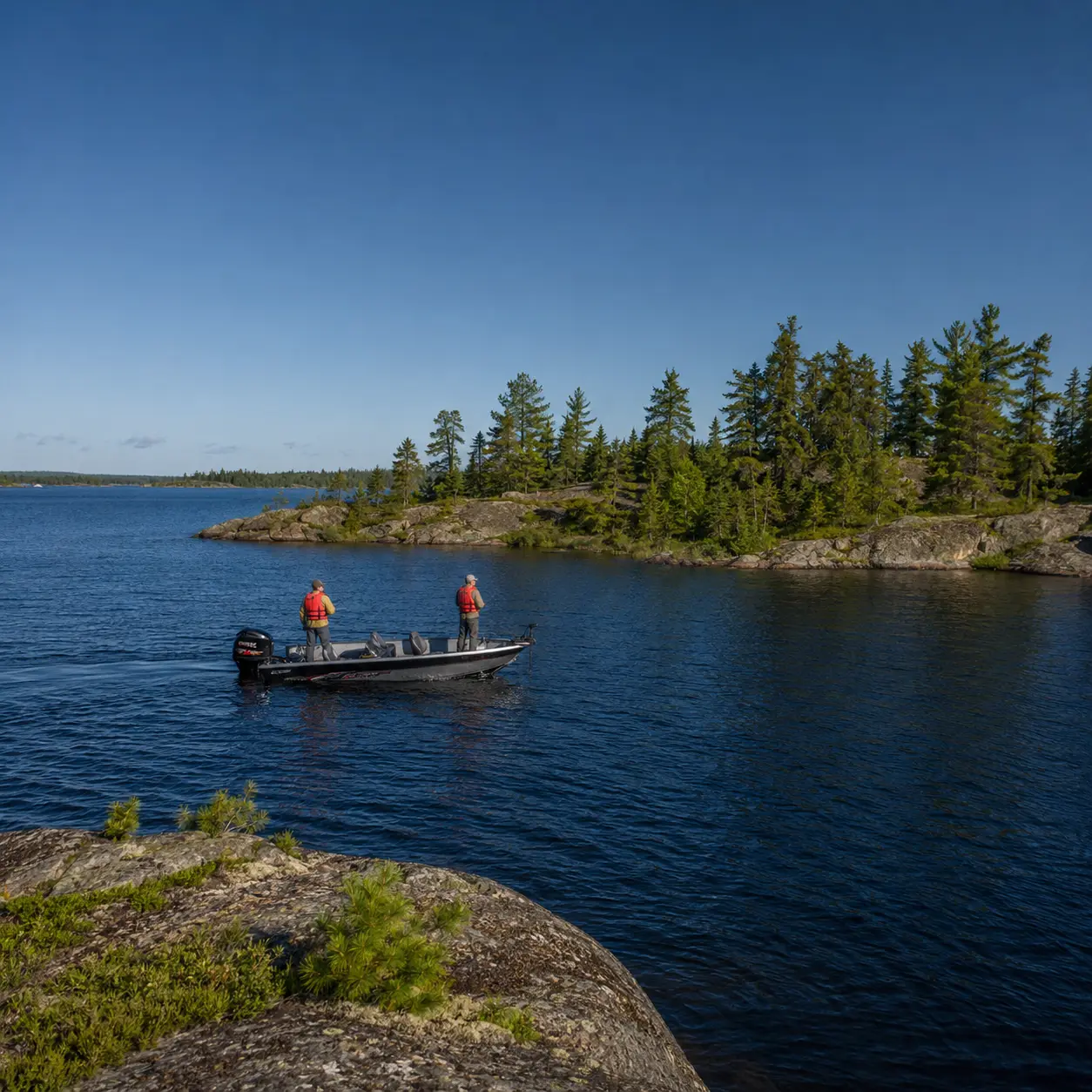 Anglers fishing among the rocky islands of Lac Seul